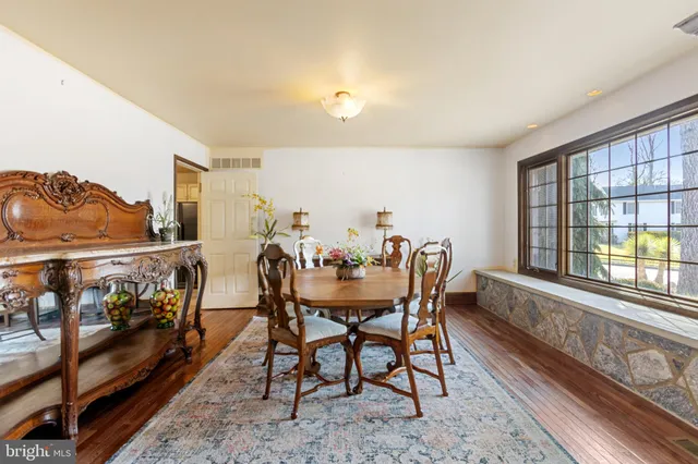 a view of a dining room with furniture and chandelier
