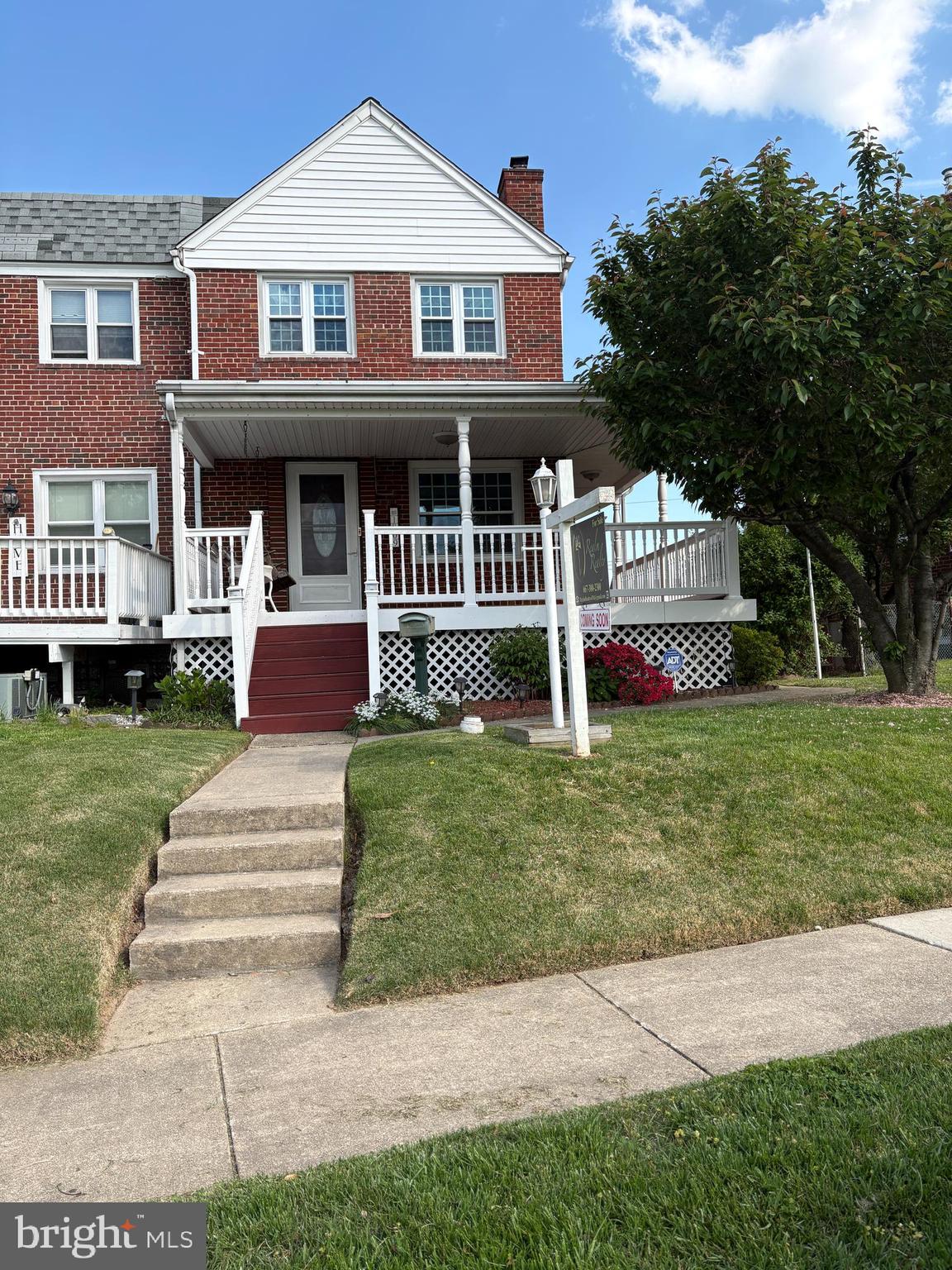 1809 Merritt Boulevard Baltimore, MD 21222 - Photo 1 of 33 a front view of a house with a yard