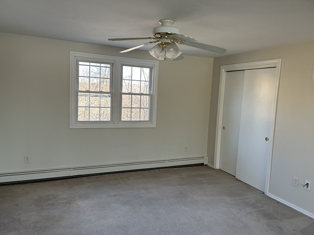 34 Uxbridge Road Sutton, MA 01590 - Photo 32 of 37 an empty room with a window
