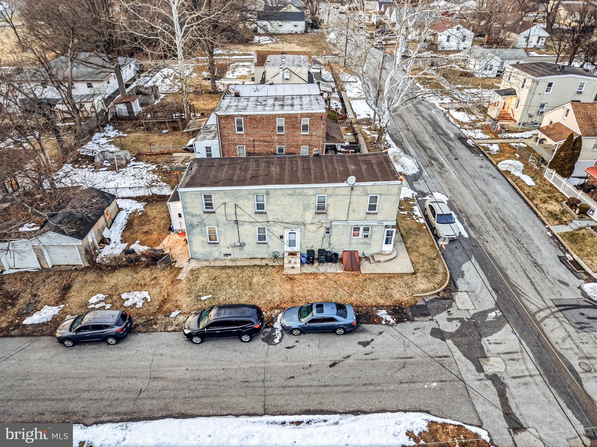 1300 Townsend Street Chester, PA 19013 - Photo 3 of 3 an aerial view of a building with parked cars