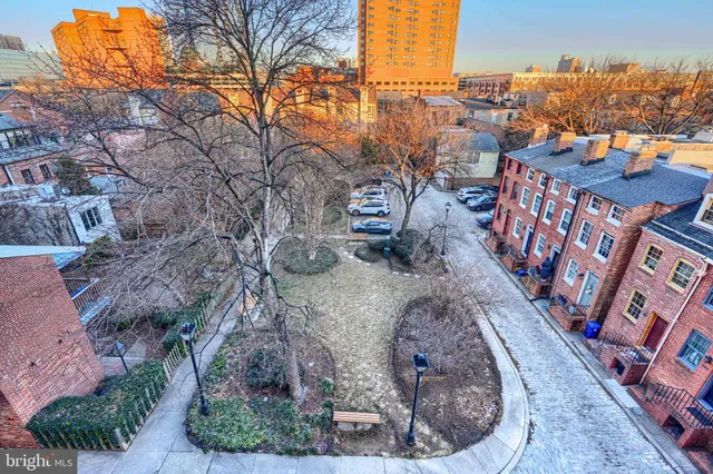 a view of a backyard both side of the house