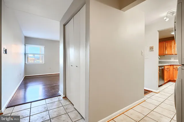 a view of an empty room and a window
