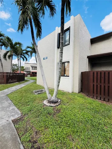 a garden view with a fountain