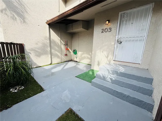 a front view of a house with garage