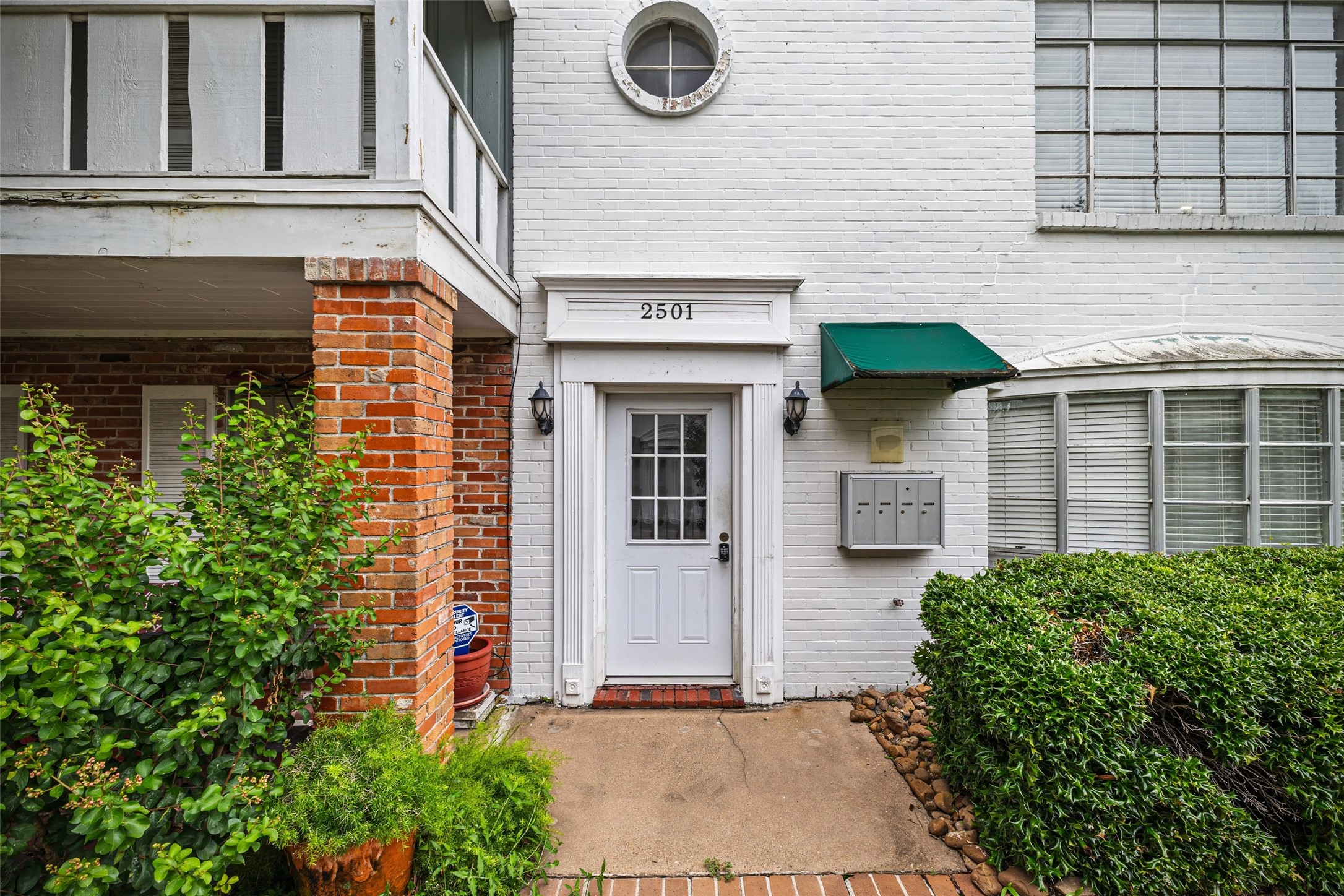 2501 Marilee Lane, Unit 4 Houston, TX 77057 - Photo 2 of 21 after entering through controlled access gates and walking through the courtyard, you can enter the building through a controlled access door