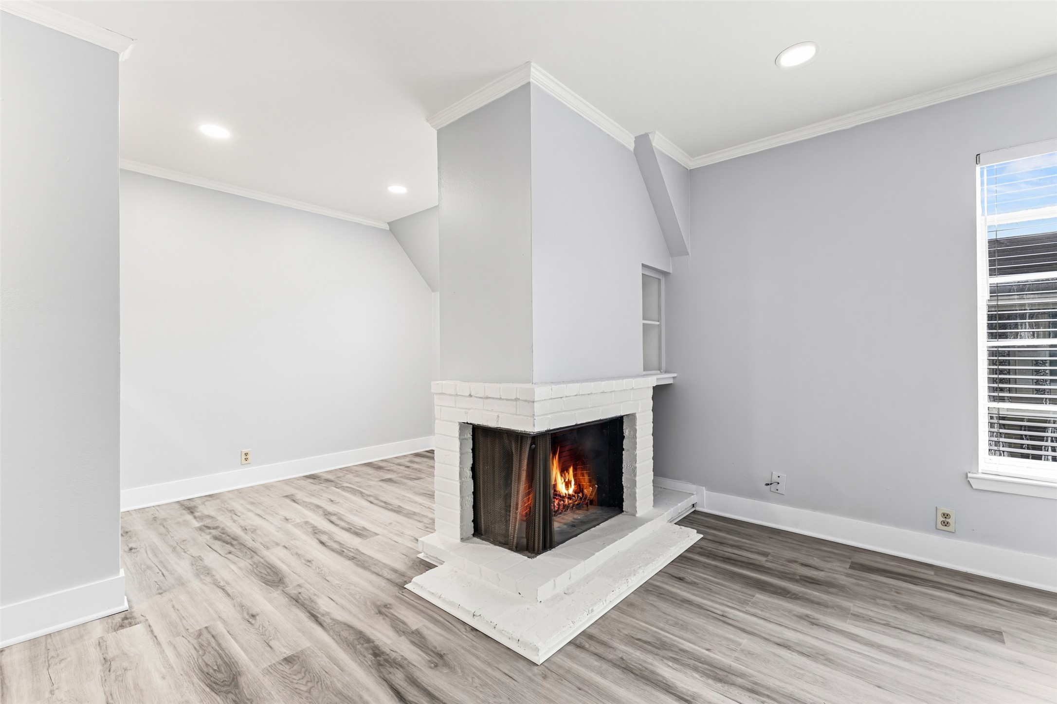 2501 Marilee Lane, Unit 4 Houston, TX 77057 - Photo 6 of 21 a fireplace separates the dining from the living area