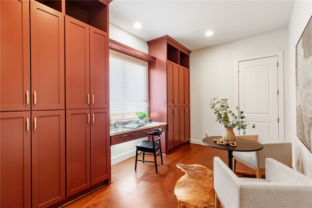 2833 Persimmon Ridge Court Bryan, TX 77807 - Photo 34 of 50 a living room with furniture a window and wooden floor