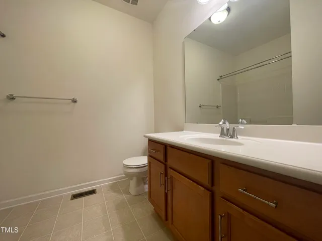 a spacious bathroom with a bathtub and a shower