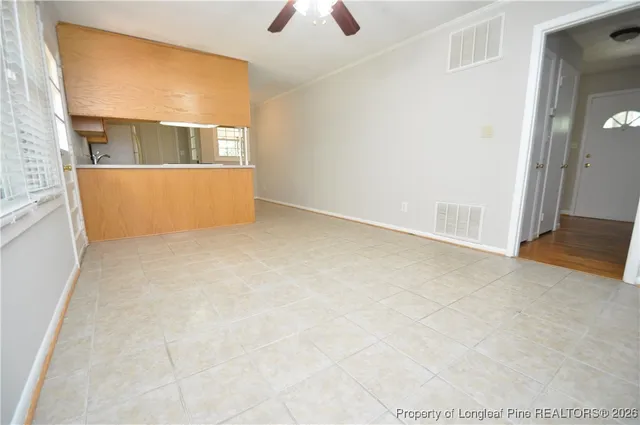 a kitchen with a sink a stove a refrigerator and cabinets