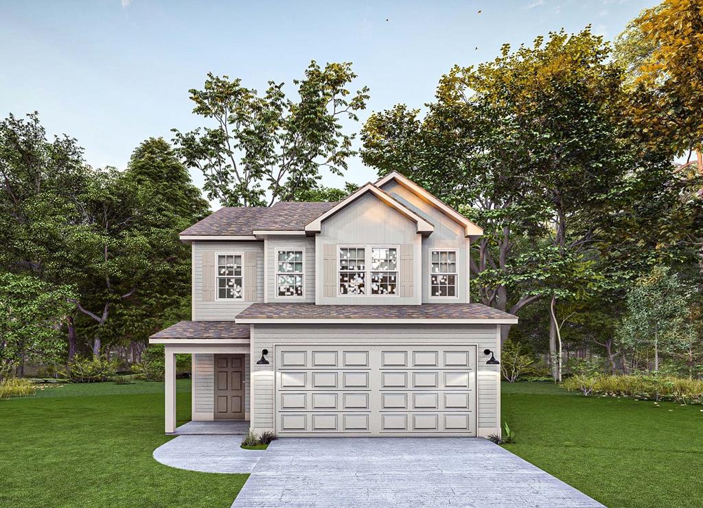 a front view of a house with a garden and yard