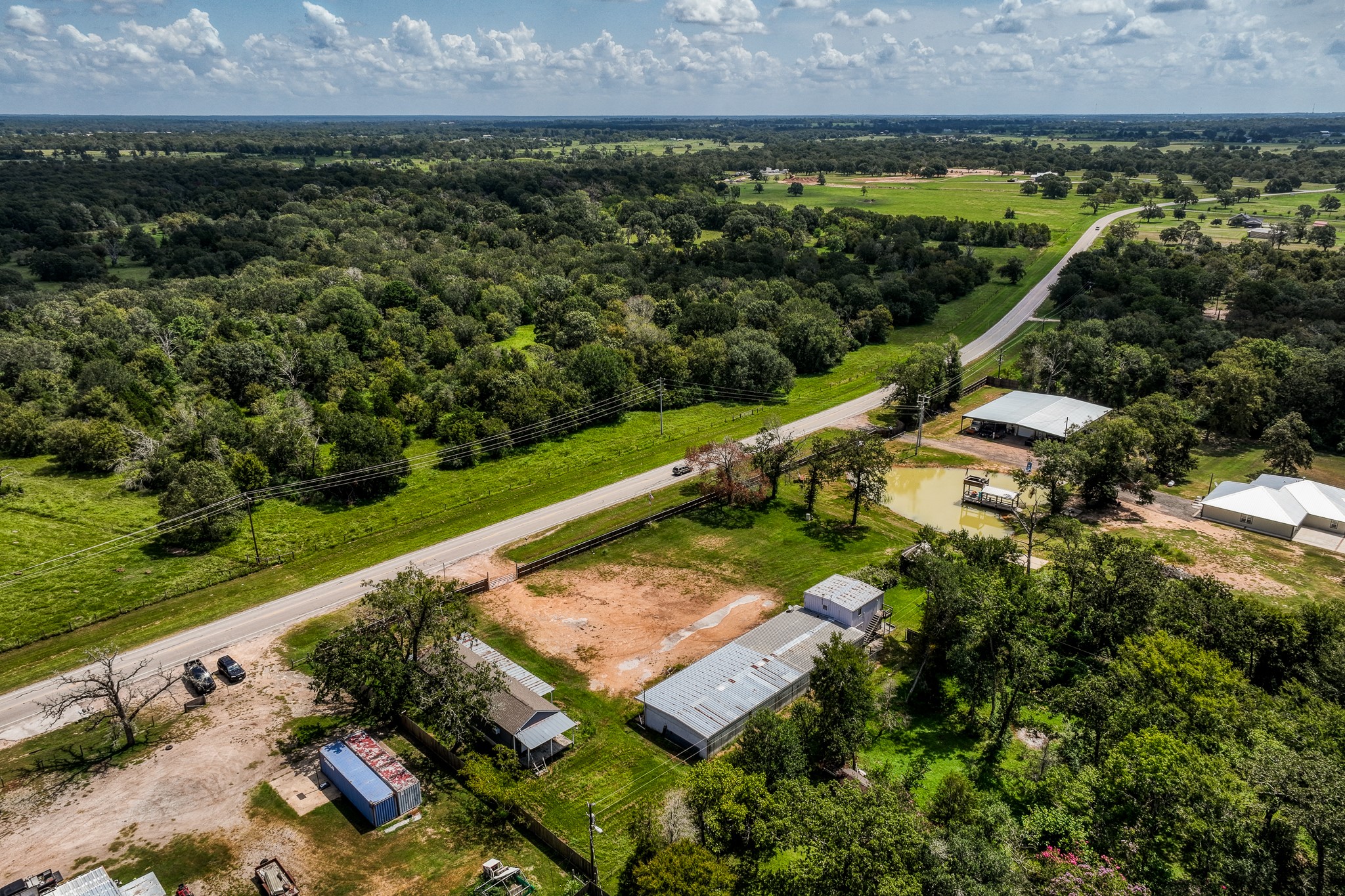 31523 Farm To Market Road 1736 Hempstead, TX 77445 - Photo 12 of 13 an aerial view of a house with a garden and lake view