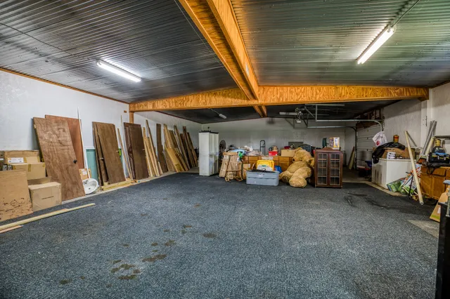 a view of a garage with parked cars