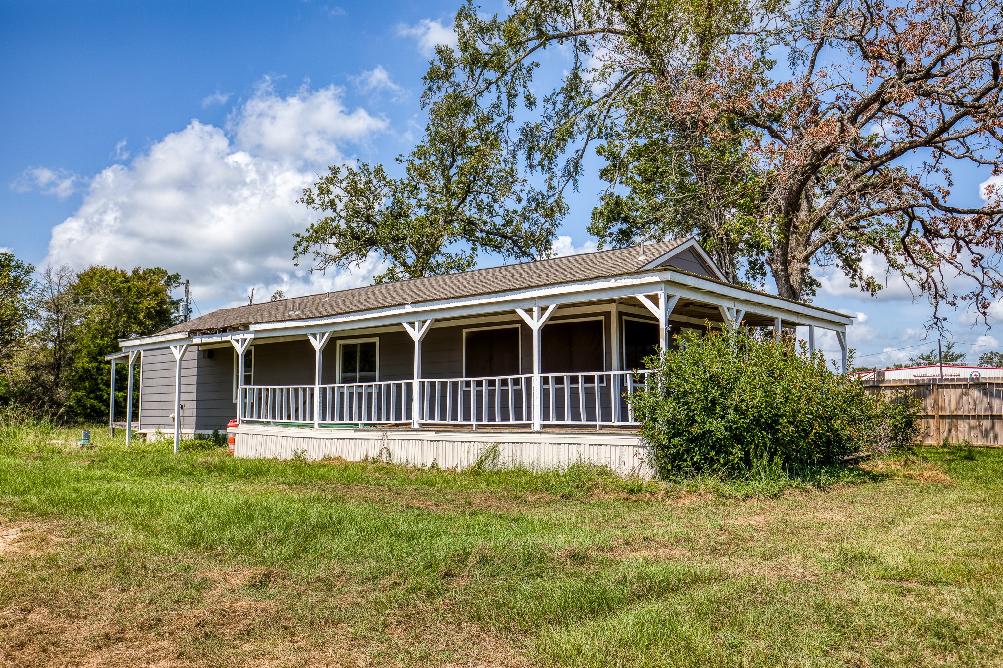31523 Farm To Market Road 1736 Hempstead, TX 77445 - Photo 9 of 13 a front view of a house with a garden