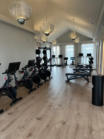 a large kitchen with a table and chairs