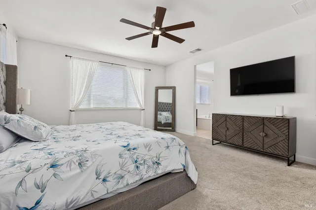 a view of a swimming pool with a yard and wooden fence