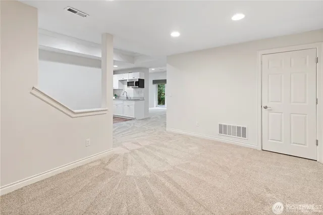 a view of a kitchen with refrigerator and cabinet