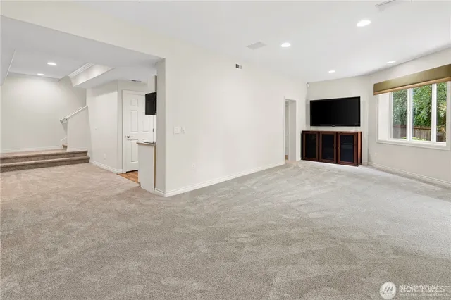 a view of an empty room with a flat screen tv