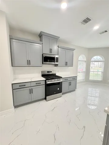 a bathroom with a shower and a sink