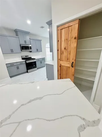 a white toilet sitting next to a shower