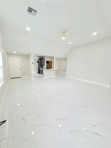 a bedroom with bed and window