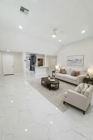 a bathroom with a double vanity sink toilet mirror and shower