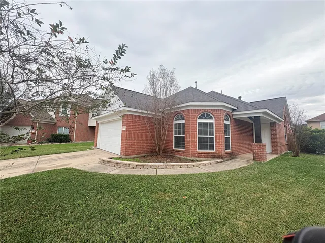 a house view with a garden space