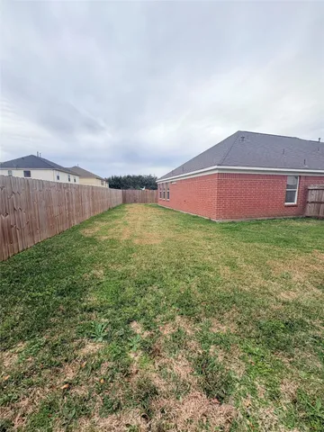 a kitchen with stainless steel appliances granite countertop a sink and a stove