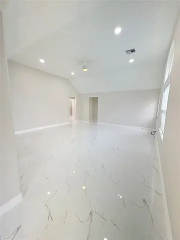 a kitchen with stainless steel appliances a refrigerator and a stove top oven