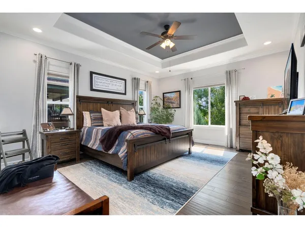 a bedroom with a bed lamps and window