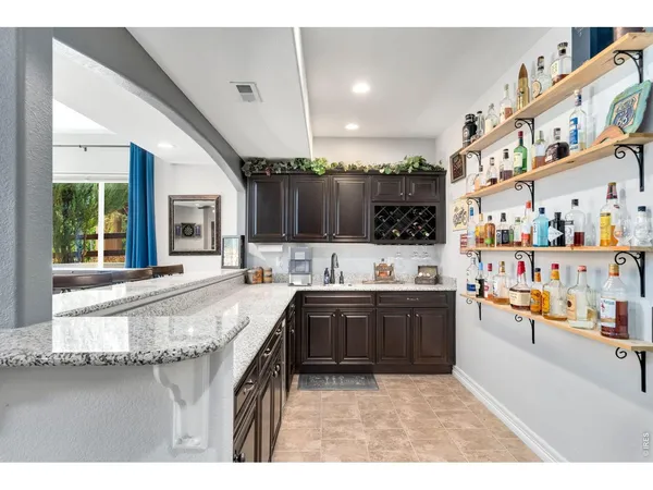 a large white kitchen with lots of counter top space
