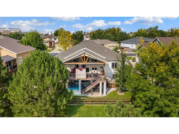 a aerial view of a house with a big yard