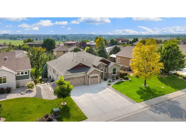 an aerial view of a house with a garden