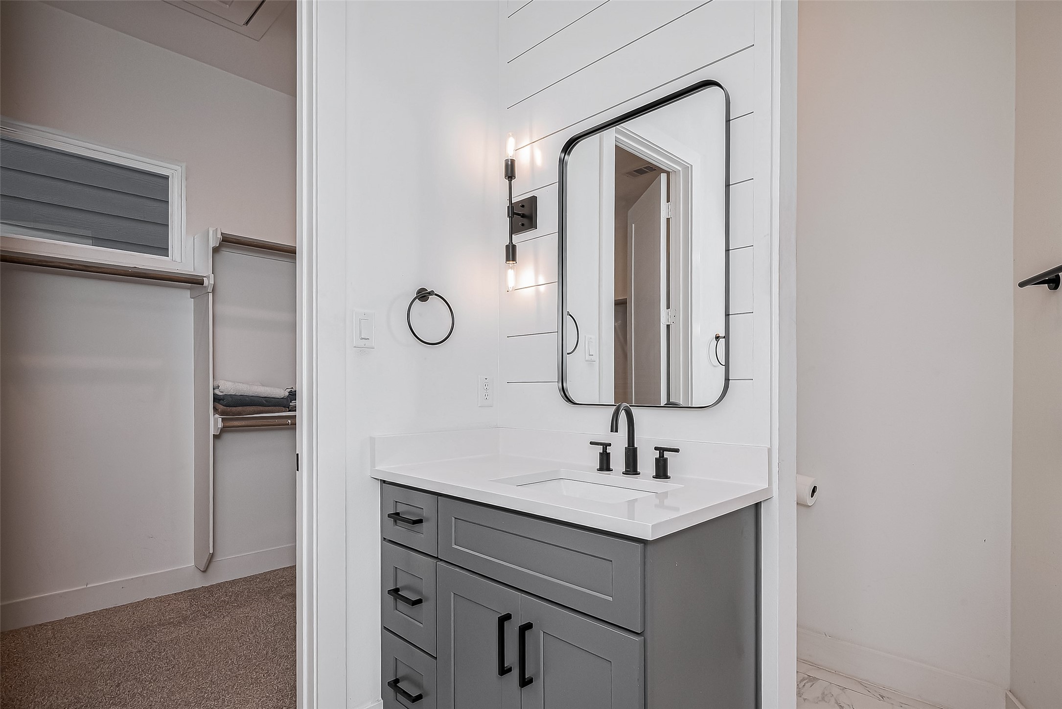 2518 Terry Street Houston, TX 77009 - Photo 15 of 17 Modern vanity area with matte black fixtures, designer lighting, and direct access to the private toilet area