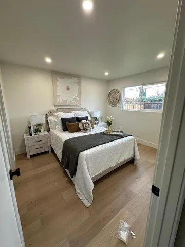 a bedroom with bed and window