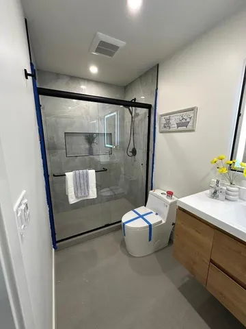 a bathroom with a sink mirror and a bath tub