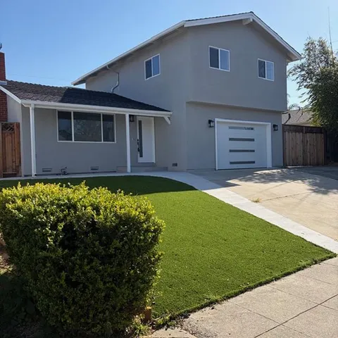 a view of a house with a garden