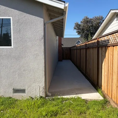 a backyard of a house with lots of green space