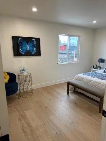 a bedroom with a bed and a desk
