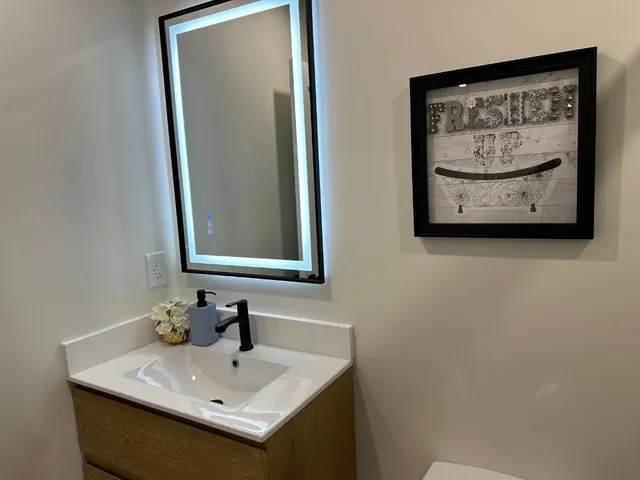 a bathroom with a sink and a mirror