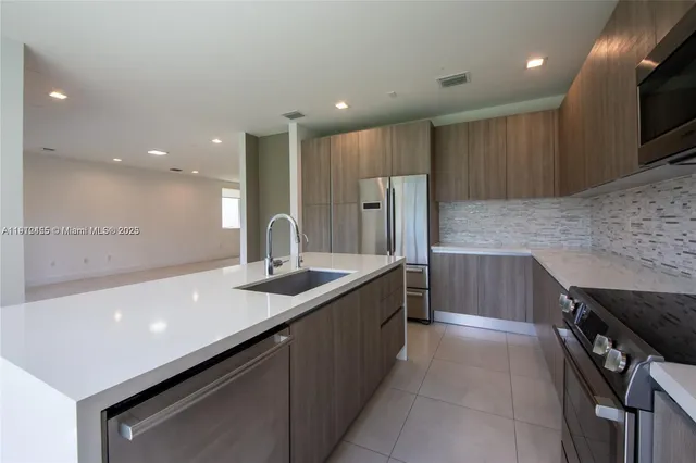 a kitchen with a sink and cabinets
