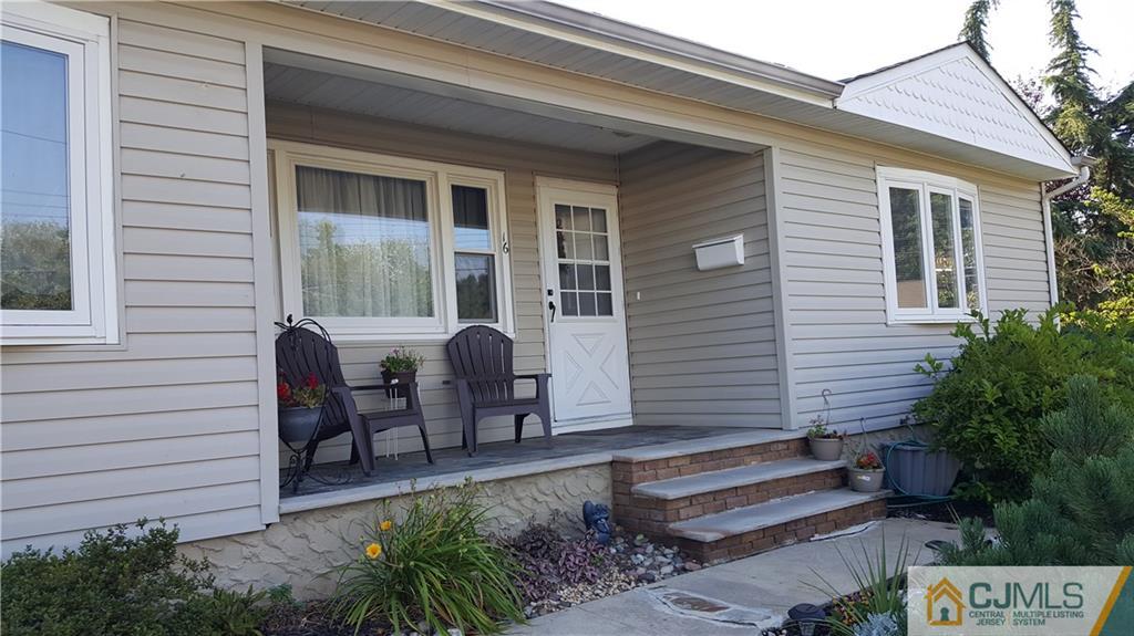 16 Ferris Road Edison, NJ 08817 - Photo 1 of 25 a front view of a house with outdoor seating and yard