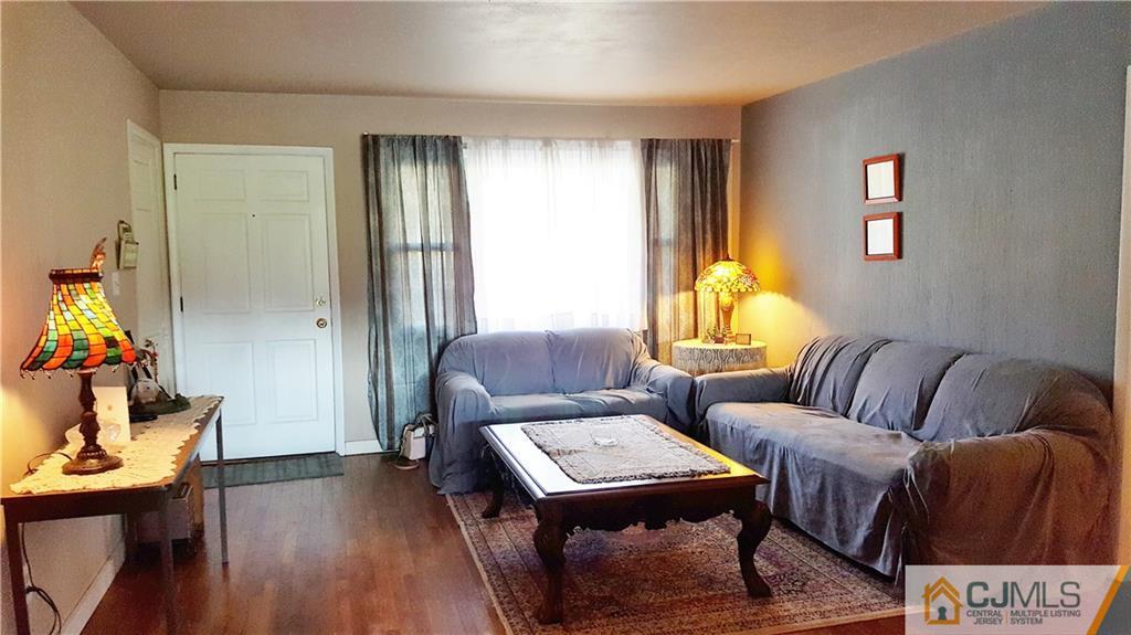 16 Ferris Road Edison, NJ 08817 - Photo 3 of 25 a living room with furniture and wooden floor
