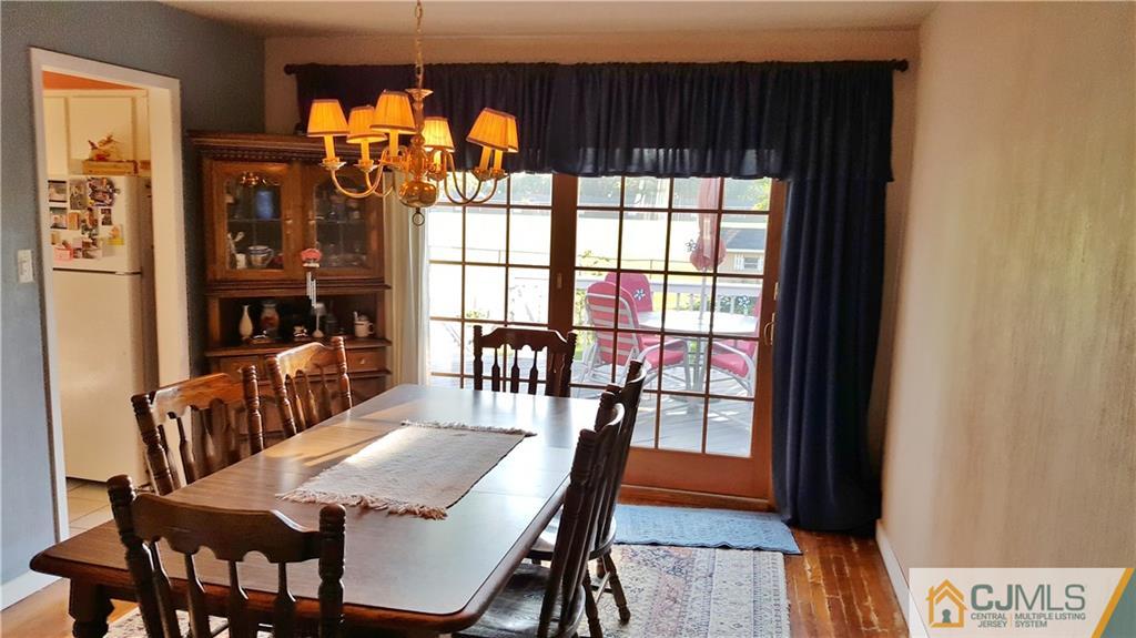 16 Ferris Road Edison, NJ 08817 - Photo 5 of 25 a view of a dining room with furniture window and wooden floor