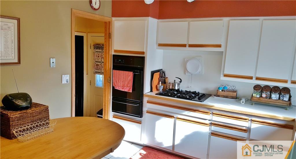 16 Ferris Road Edison, NJ 08817 - Photo 6 of 25 a kitchen with stainless steel appliances granite countertop a stove a sink and a refrigerator