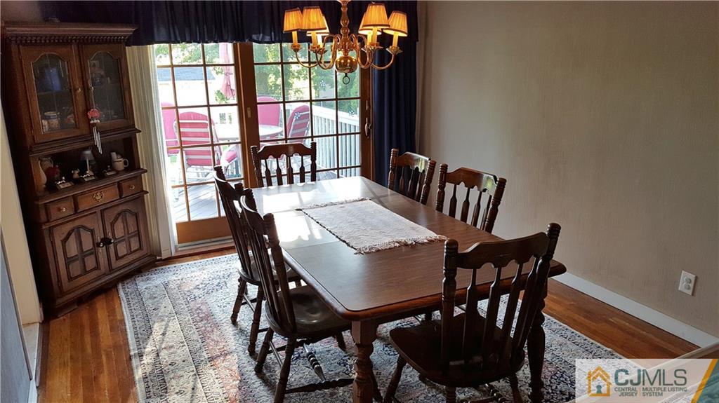 16 Ferris Road Edison, NJ 08817 - Photo 8 of 25 a view of a dining room with furniture window and outside view