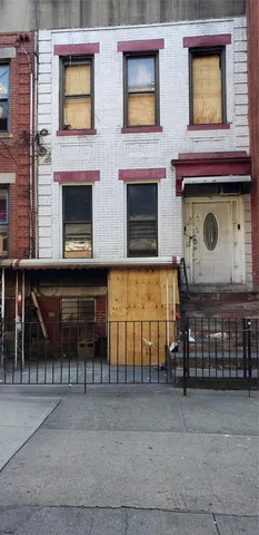 a view of a brick building with many windows