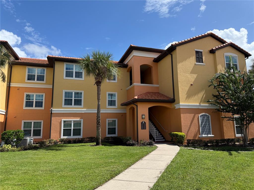 5455 Vineland Road, Unit 3302 Orlando, FL 32811 - Photo 1 of 1 a front view of a house with a yard