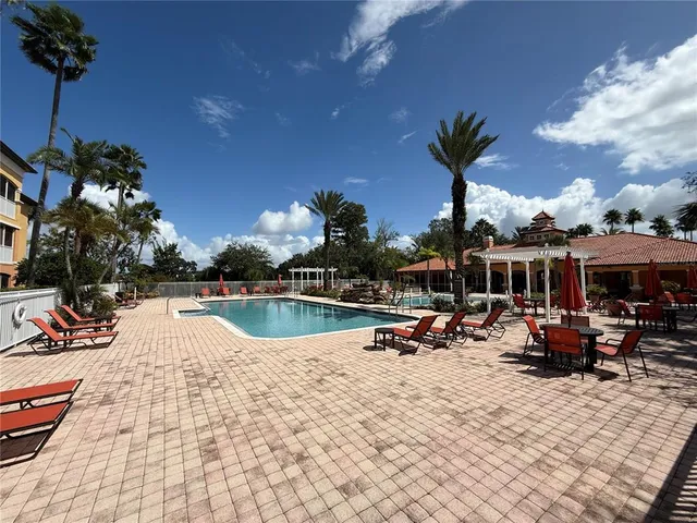a view of a swimming pool with chairs