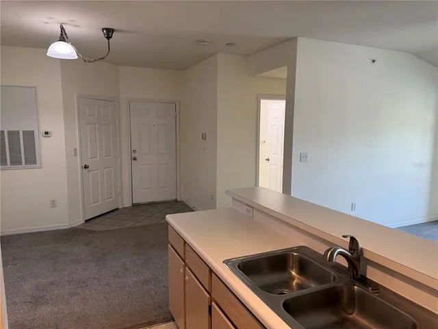 a kitchen with a sink and cabinets