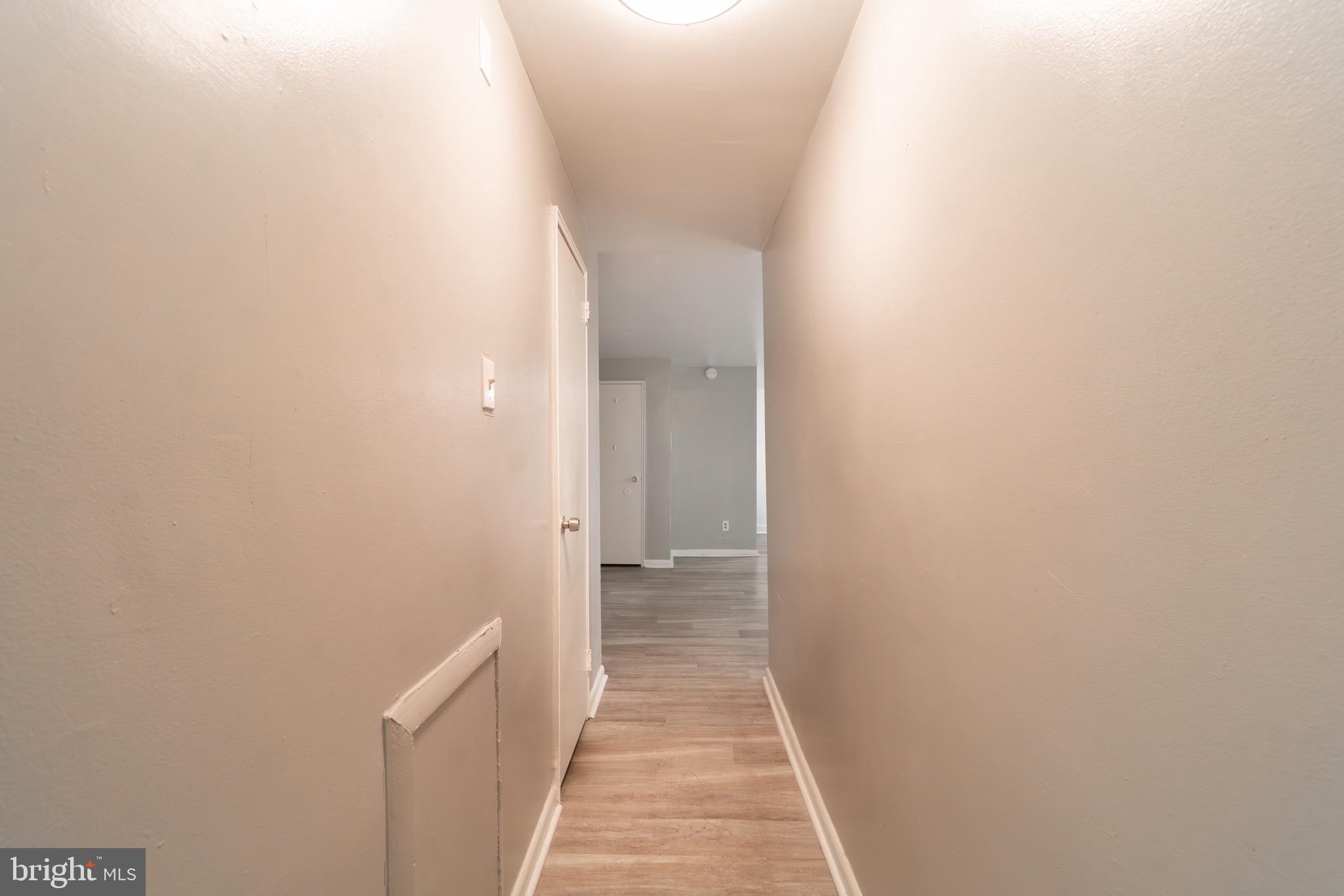 4616 Leiper Street, Unit D11 Philadelphia, PA 19124 - Photo 5 of 11 a view of a hallway with wooden floor